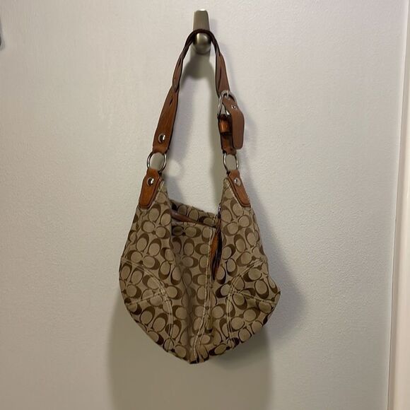 Coach woman’s brown canvas with twisted brown leather strap. - Picture 2 of 11